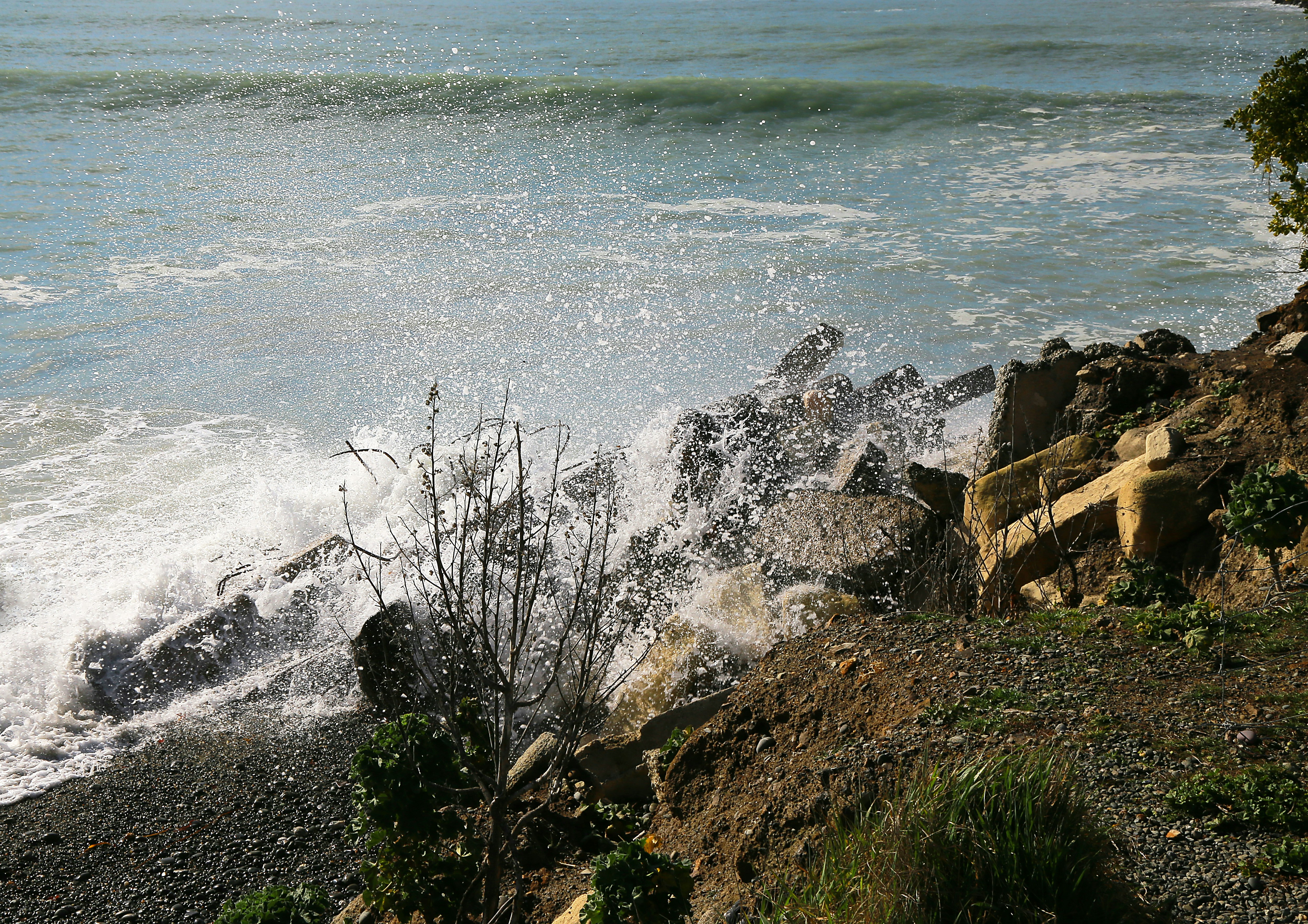 brown rocks near body of water